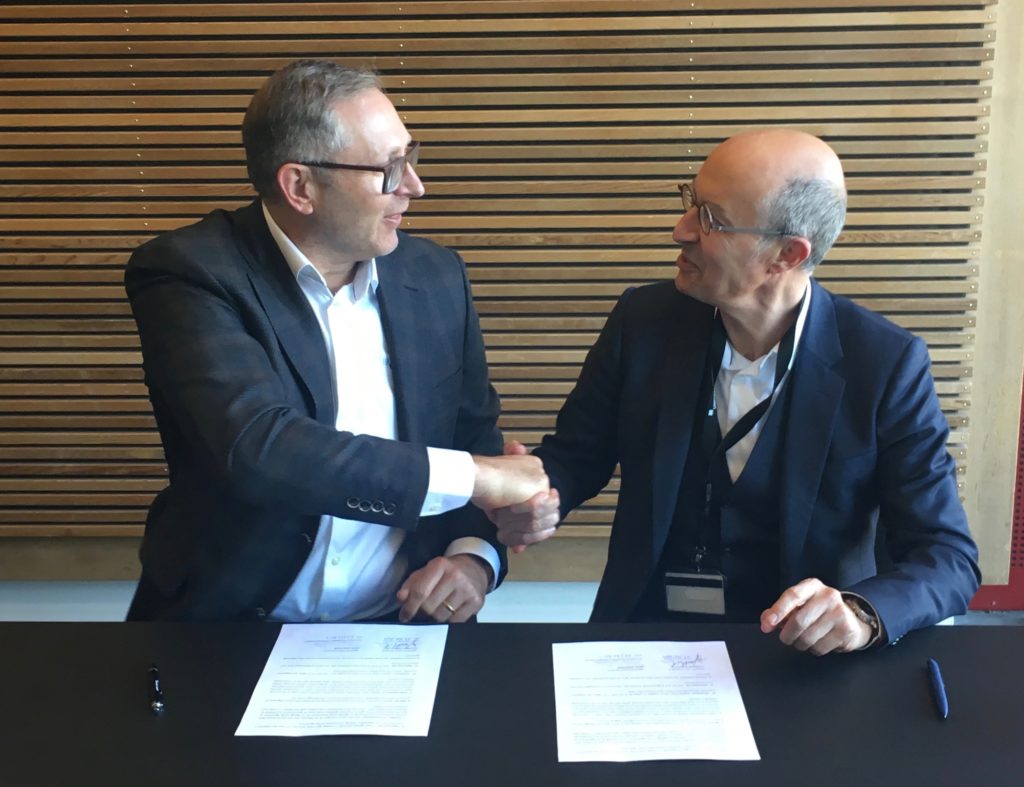 Universal Robots President Jürgen von Hollen and Sepro Group CEO Jean-Michel Renaudeau at agreement signing.