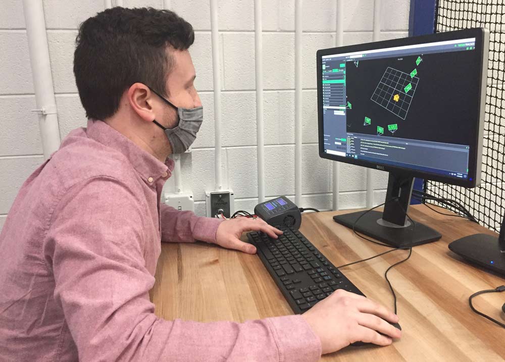 Graduate student Kevin Webb monitors the control algorithm