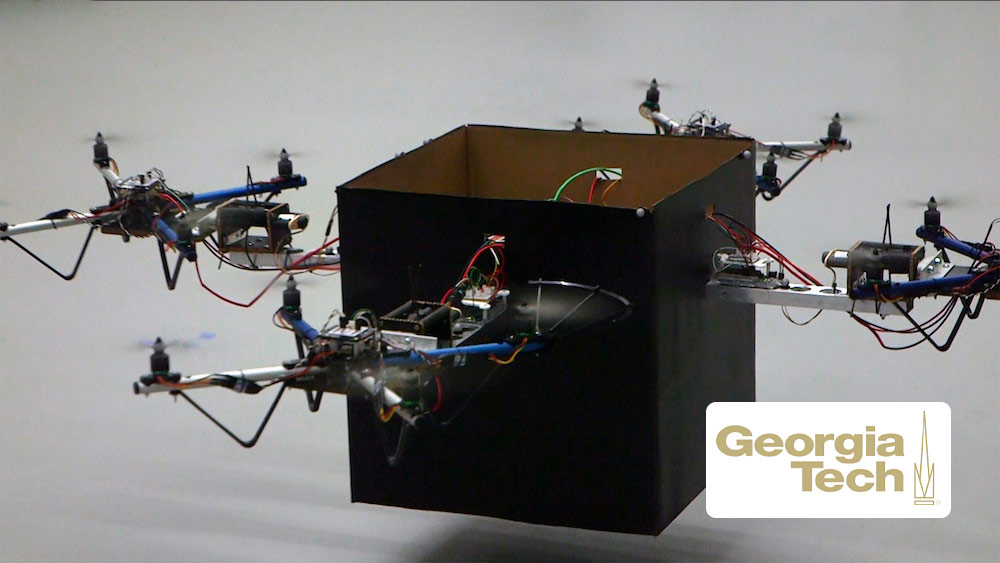 Multiple drones move a single box