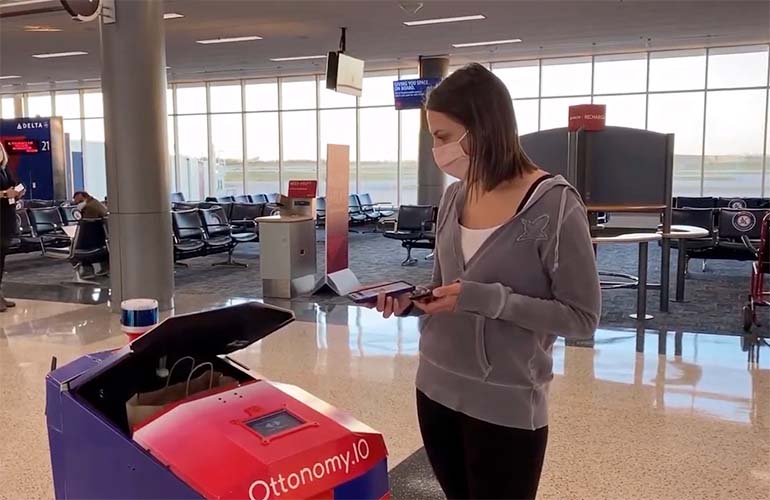 ottonomy AMR delivers to patron at the airport terminal