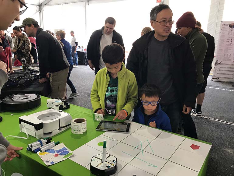 kids play with drawing robot