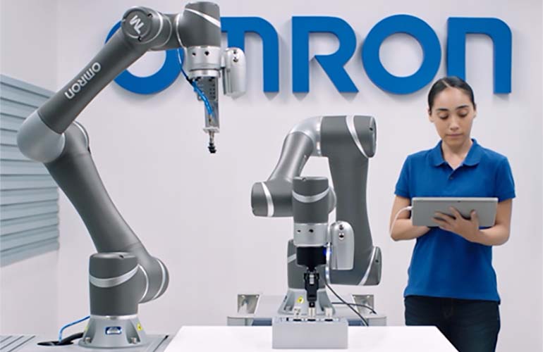 OMRON Applications engineers programs a Techman robot.