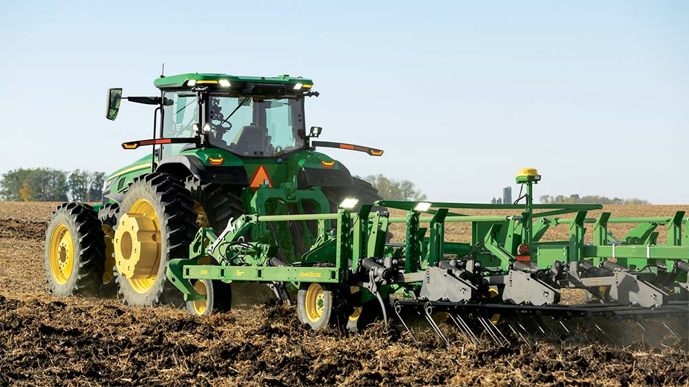 John Deere 8R Autonomous tractor tilling a field