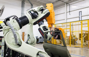two robots welding an automotive door