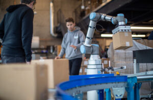 A UR cobot performs a place operation.