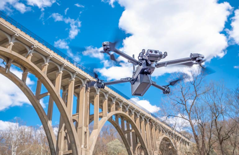 a akydio drone inspects a bridge.