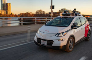 A Cruise robotaxi driving on a bridge.