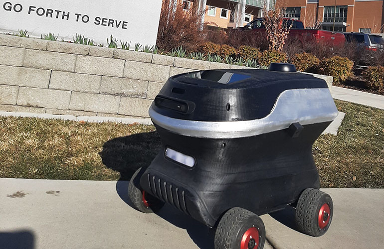Delivery robot on a sidewalk. 