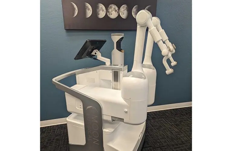 Moon Surgical’s Maestro surgical robotics system has two arms that can hold the same laparoscopic instruments that surgeons already use. 