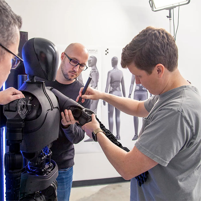 Figure.AI engineers work on a prototype humanoid robot.