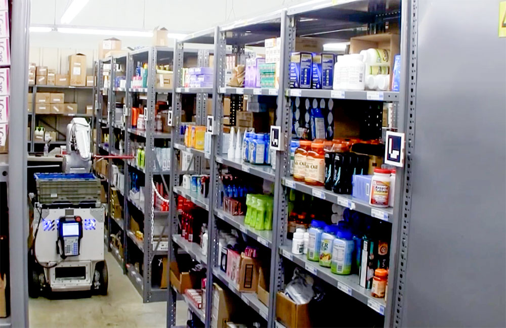 IAM Robotics Swift robot picks items in a warehouse.