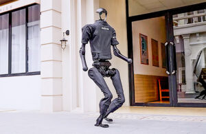 unitree H1 robot walking down the street.