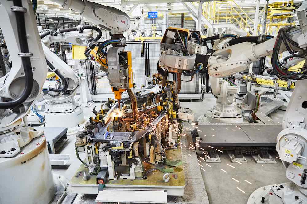 ABB robots welding part of an electric vehicle.