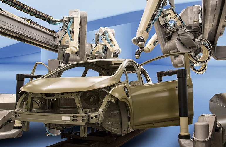 fanuc robots manufacture cars on an assembly line.