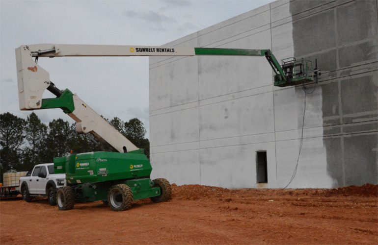 A PaintJet robot applying the company's paint to a building. 