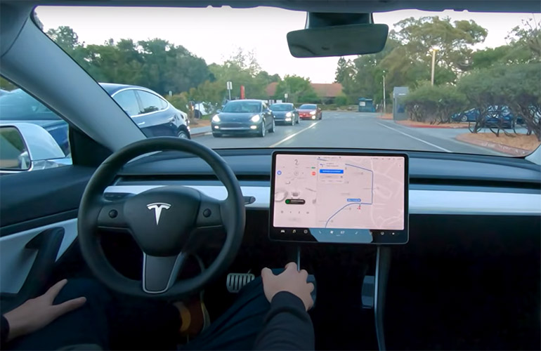 A Tesla car in Full Self Driving mode.