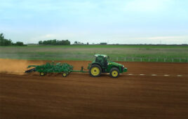 John Deere tractor at work in a field.