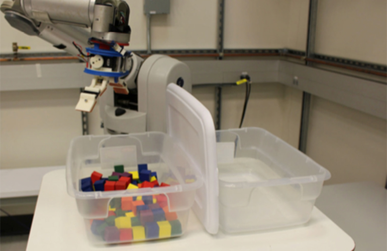 A robot preparing to pick individual blocks, one of the tasks in the Robotic Grasping and Manipulation Competition. 