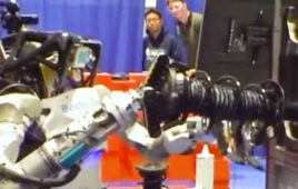 Boston Dynamics' Atlas humanoid picking an automotive strut.