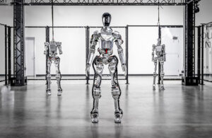 three figure ai humanoid robots standing in a row.