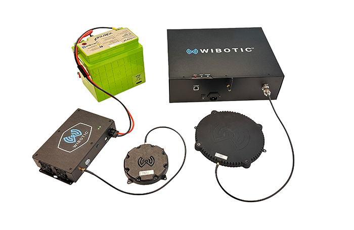 hero image of the complete wibotic 1kw product including power unit, transfer pad, robot power receiver and onboard charging unit.