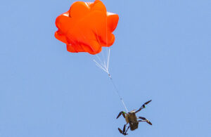 ParaZero Technologies' SafeAir system autonomously detects flight anomalies and deploys the parachute swiftly, ensuring reliability.