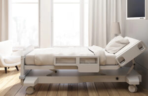 An image of a white hospital bed inside a white hospital room.