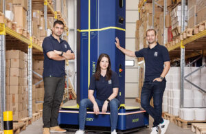 Dexory’s three founders, Andrei Danescu, Oana Jinga, and Adrian Negoita with the company’s DexoryView robot.