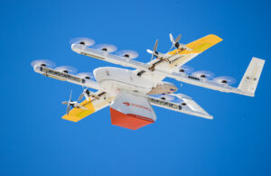 A Wing drone carrying a DoorDash package.