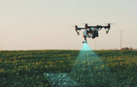 A white drone flying above a field of product scanning the crops. Foresight says NVIDIA Jetson will help drone perception.