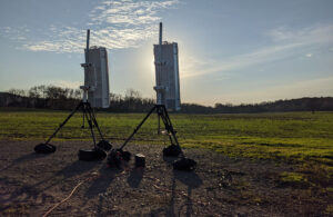 Hidden Levels' sensors set up on tripods in a field.