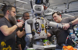 boston dynamics engineers work on an Atlas humanoid robot.