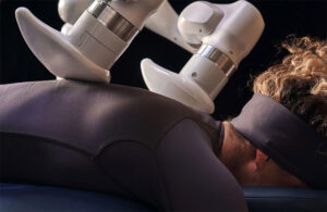 Aescape massage robot giving a customer a massage.