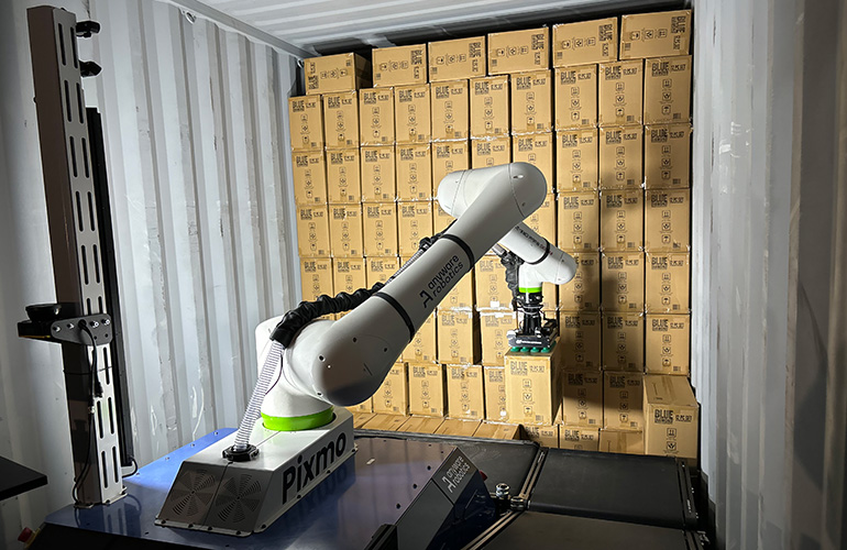anyware robotics mobile manipulator unloads boxes from a shipping container.