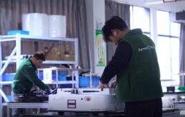 People working to build ForwardX robots at its new facility.