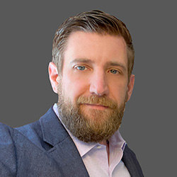 headshot of Kevin Dumas.