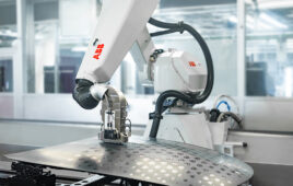 An ABB robot painting a car hood.