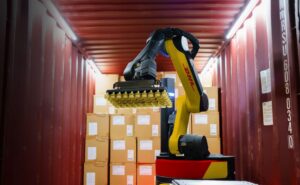 A Boston Dynamics Stretch robot unloading a container for DHL.
