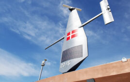 One of Saildrone's uncrewed surface vehicles (USVs) with the Denmark flag on it.
