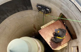 A Gecko crawler robot inspecting the side of a missile silo.