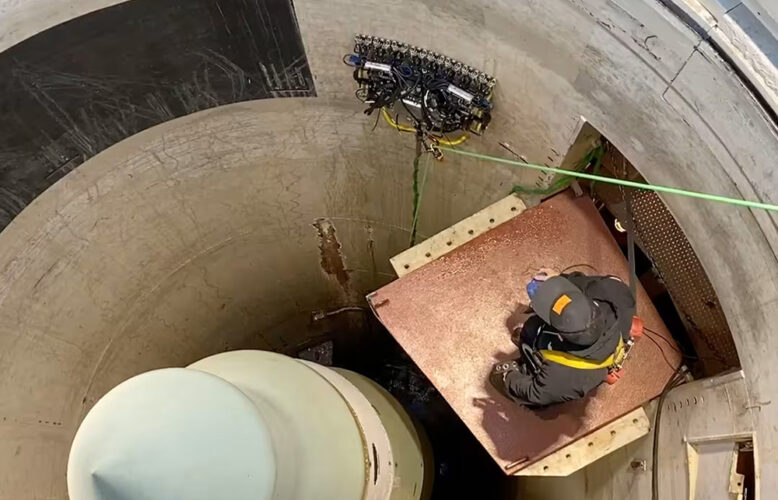 A Gecko crawler robot inspecting the side of a missile silo.