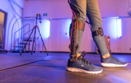 A shot of a person's legs with an exoskeleton on.