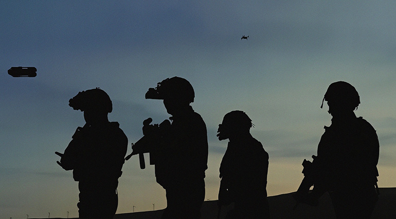 Silhouette of soldiers with XTEND drones.