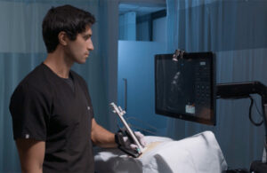 A man using Focalist on a covered patient.