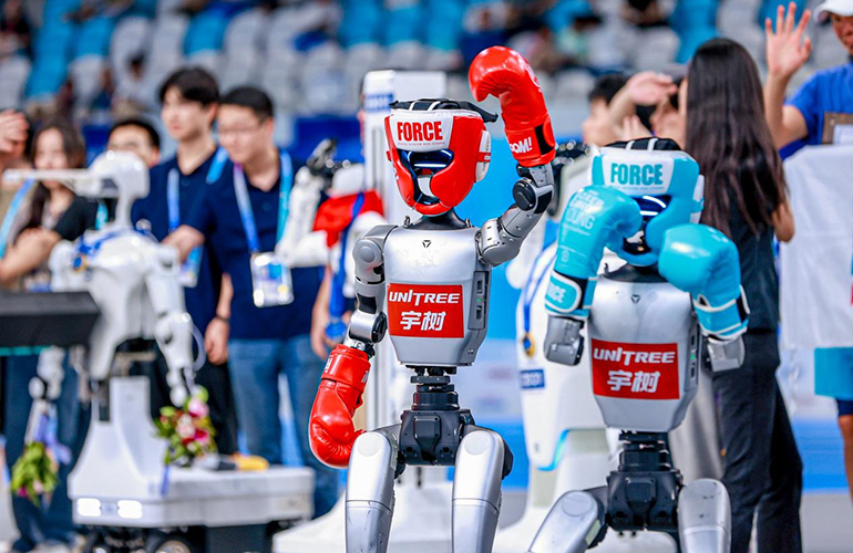 boxing robots from unitree in the ring.