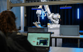 operator programs an ABB robot.