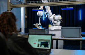 operator programs an ABB robot.