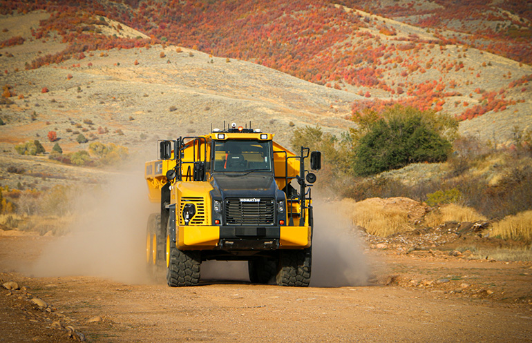 A construction vehicle with autonomous technology. ASI has worked with construction vehicle OEMs and partnered with SoftBank.