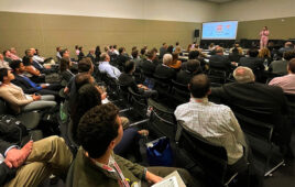 A person giving a talk at the Robotics Summit & Expo.