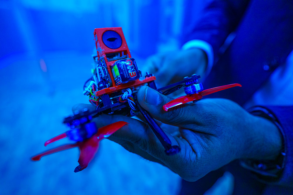 A person holding a WPI drone.